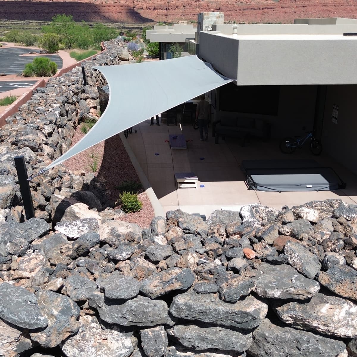 Curved shade sail with desert landscape