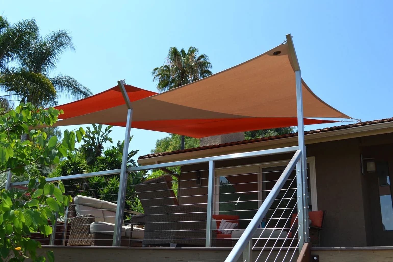 Red and tan residential shade sails