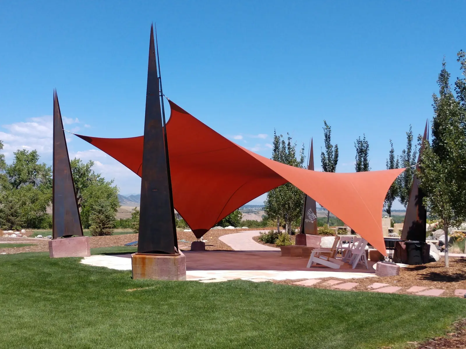 Custom red shade sail over a Phoenix public art park