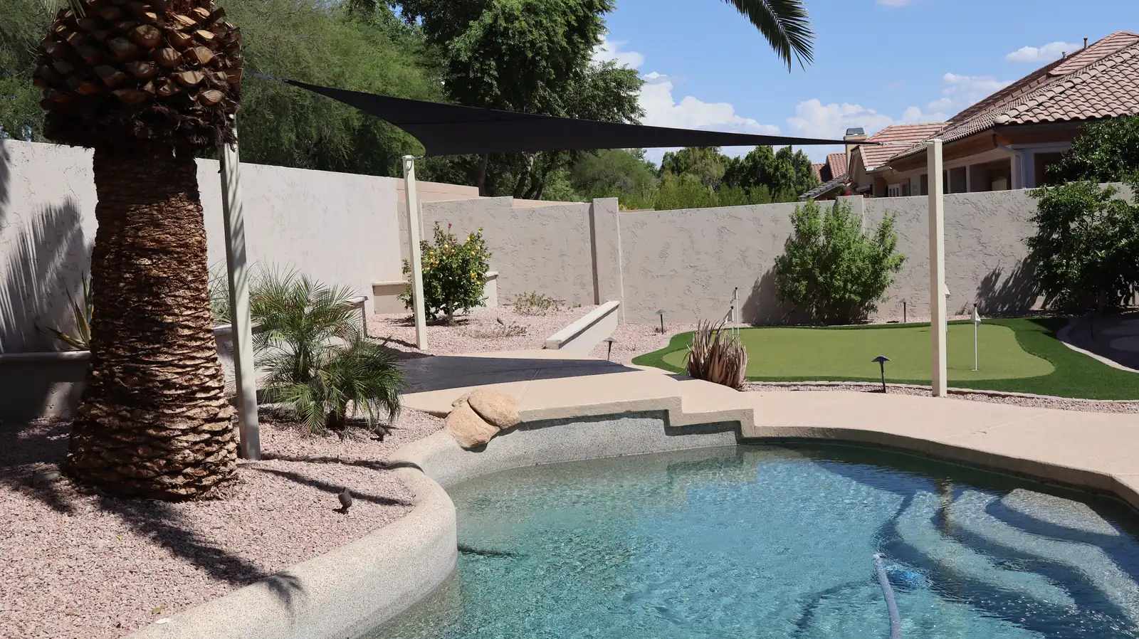 The finished shade sail in his backyard